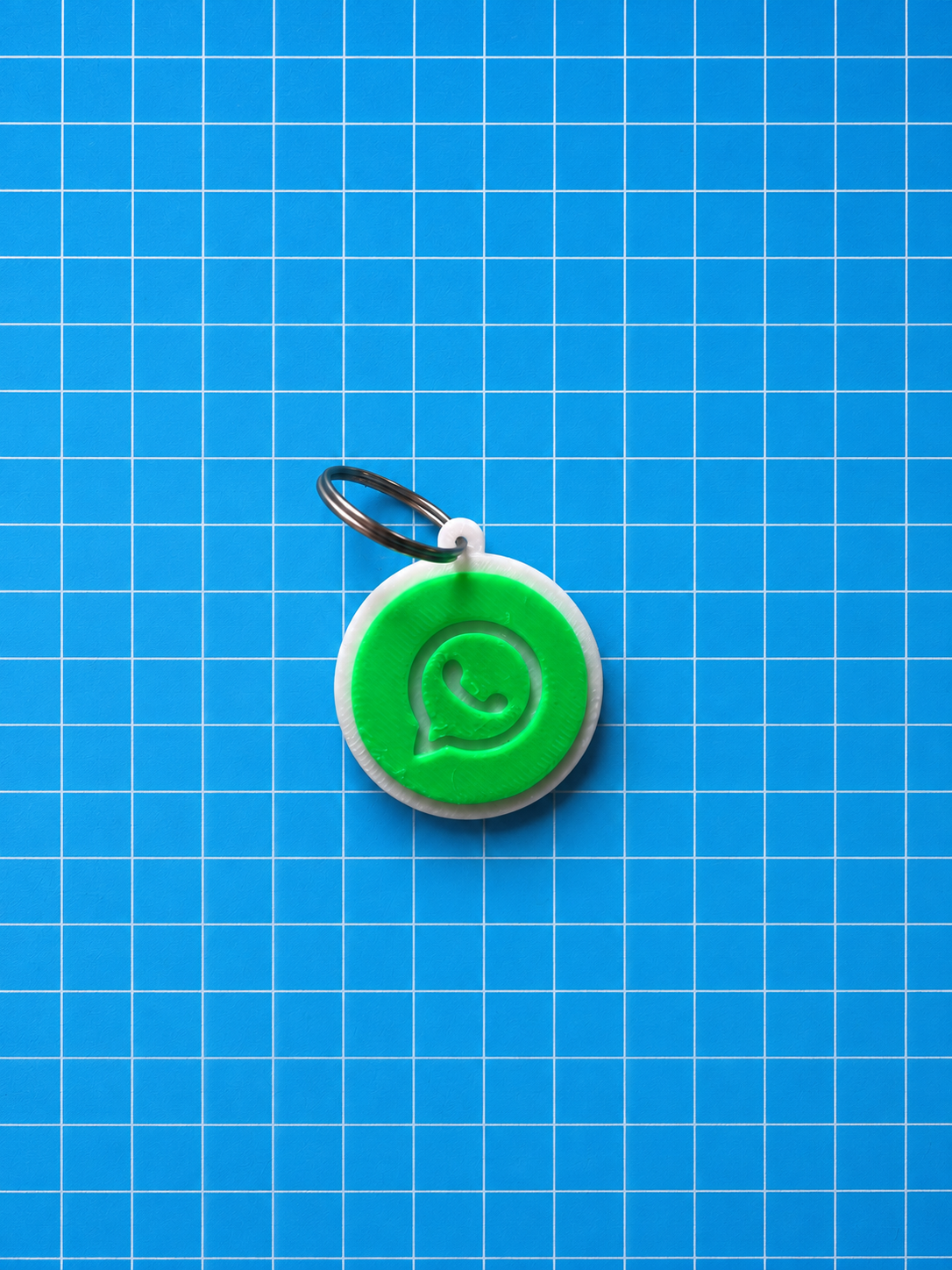 3D Printed NFC WhatsApp Tag on blue grid background